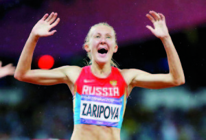 Russia's Yuliya Zaripova celebrates after winning the women's 3000m steeplechase final at the London 2012 Olympic Games at the Olympic Stadium